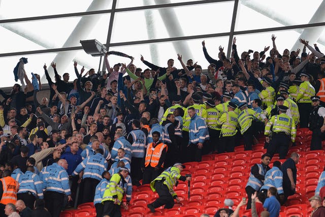Millwall fans clash with police after attempting to charge the Barnsley fans