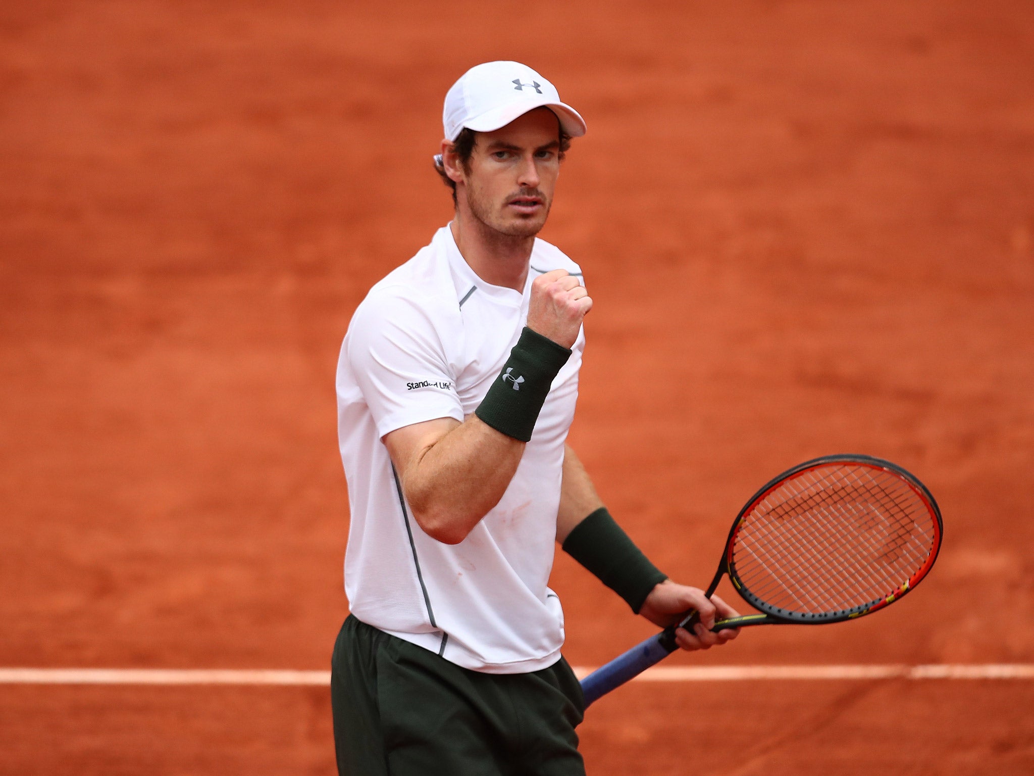 Andy Murray celebrates his French Open fourth round victory over John Isner