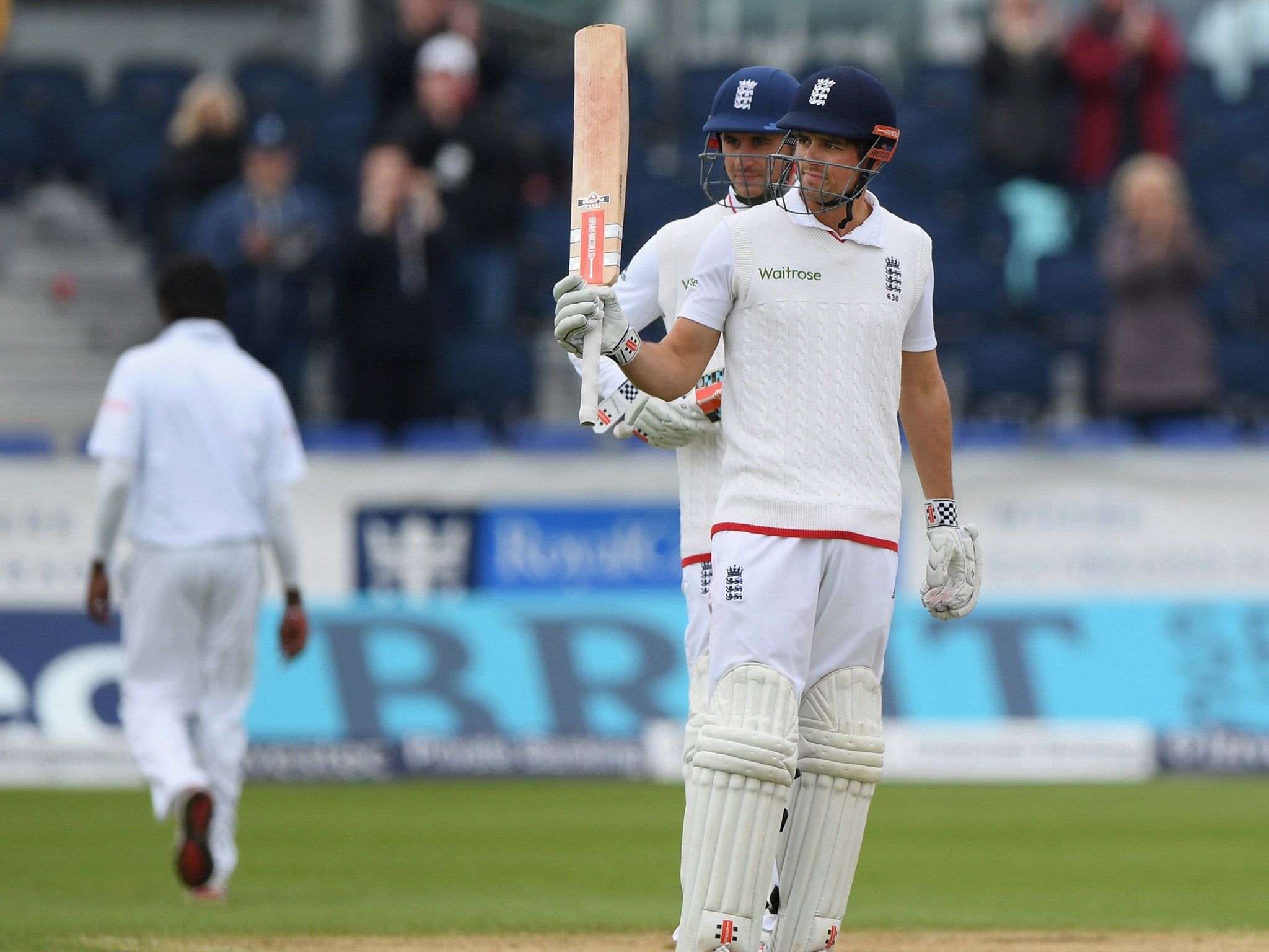 Alastair Cook salutes the crowd after reaching 10,000 Test runs