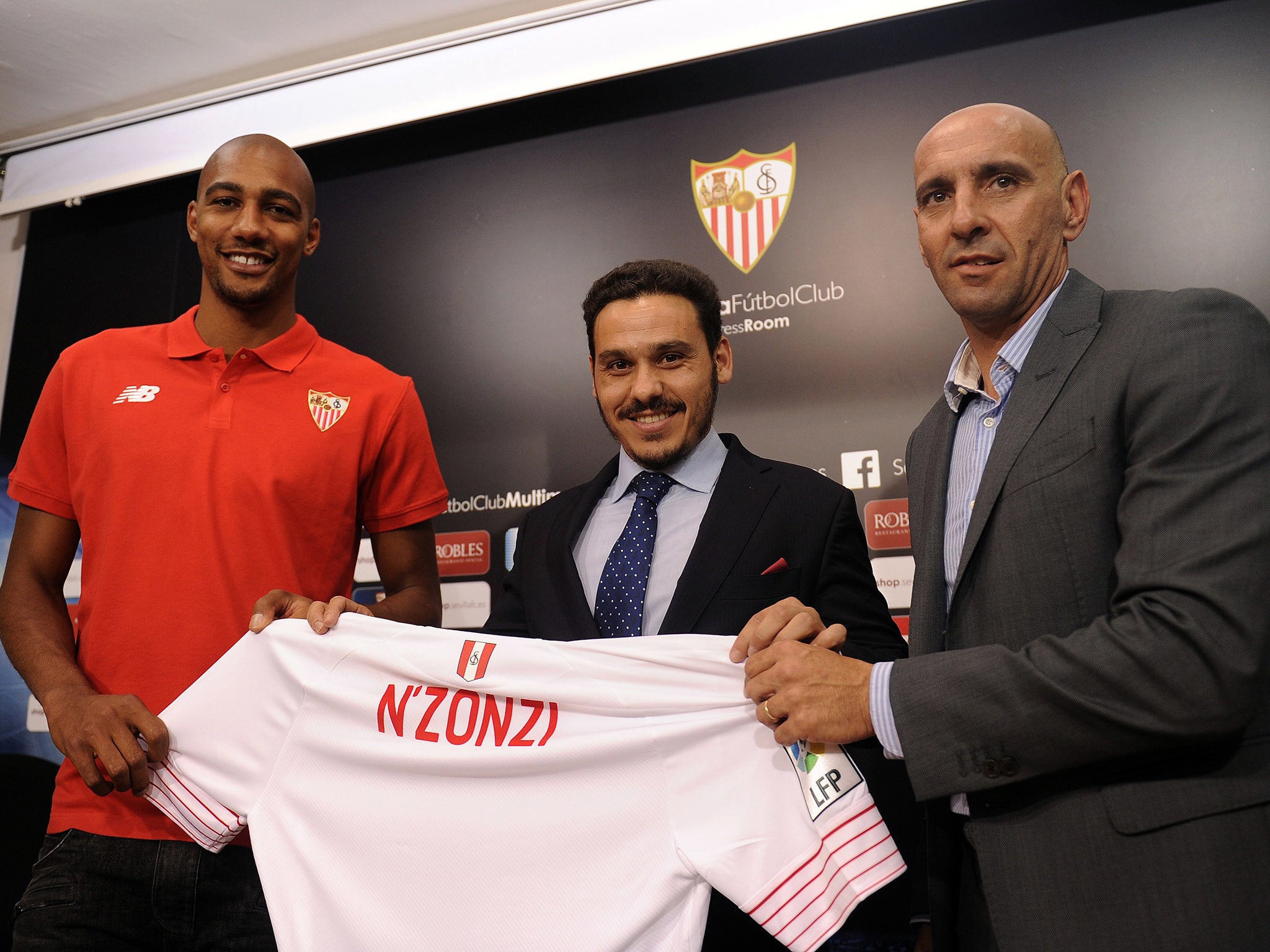 Monchi, right, unveils the signing of Steven N'Zonzi last summer