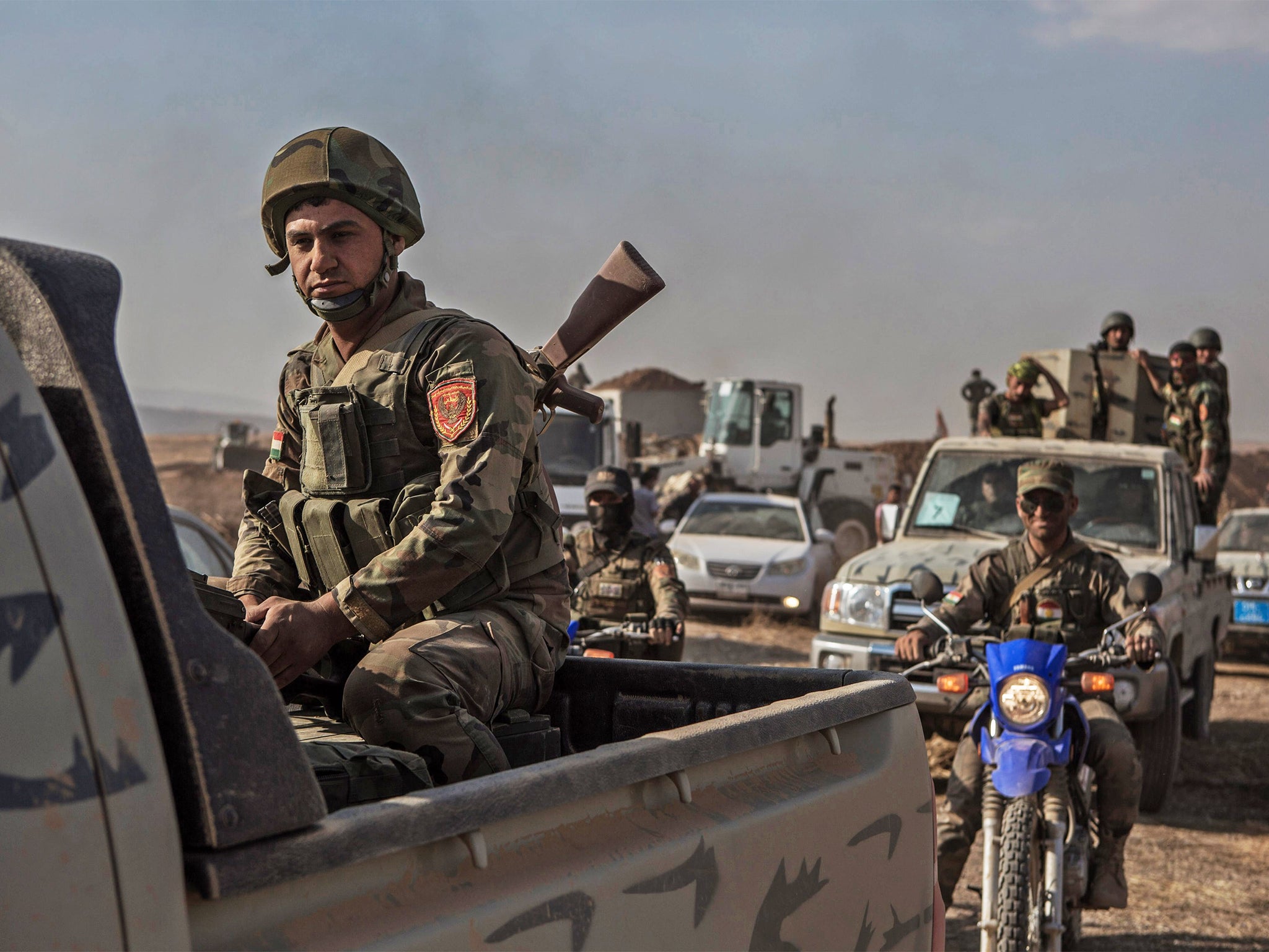 Kurdish Peshmerga forces move into Mosul’s Mufti village after it was recaptured from Isis in May
