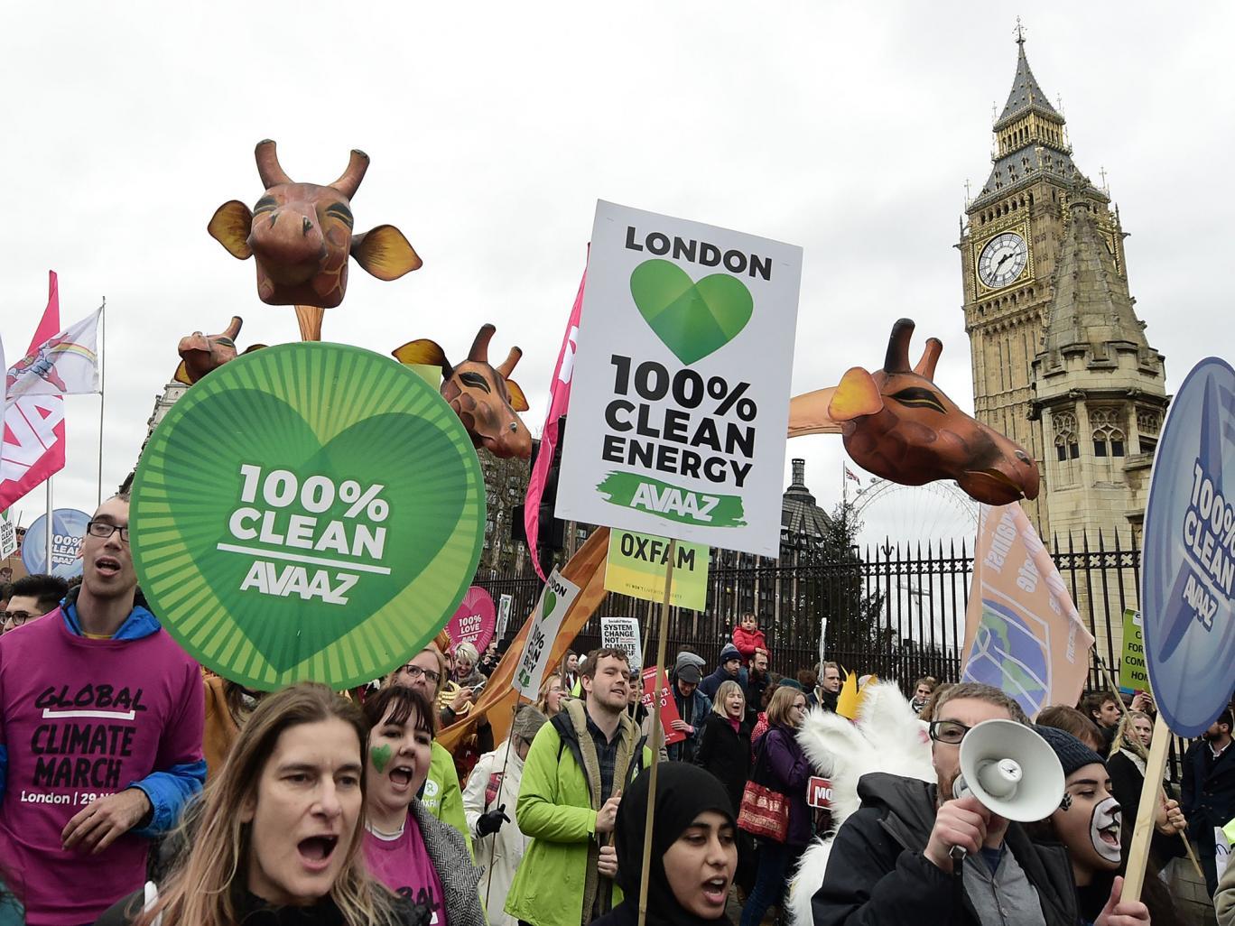 Protesters outside Parliament call for the end of the use of fossil fuels