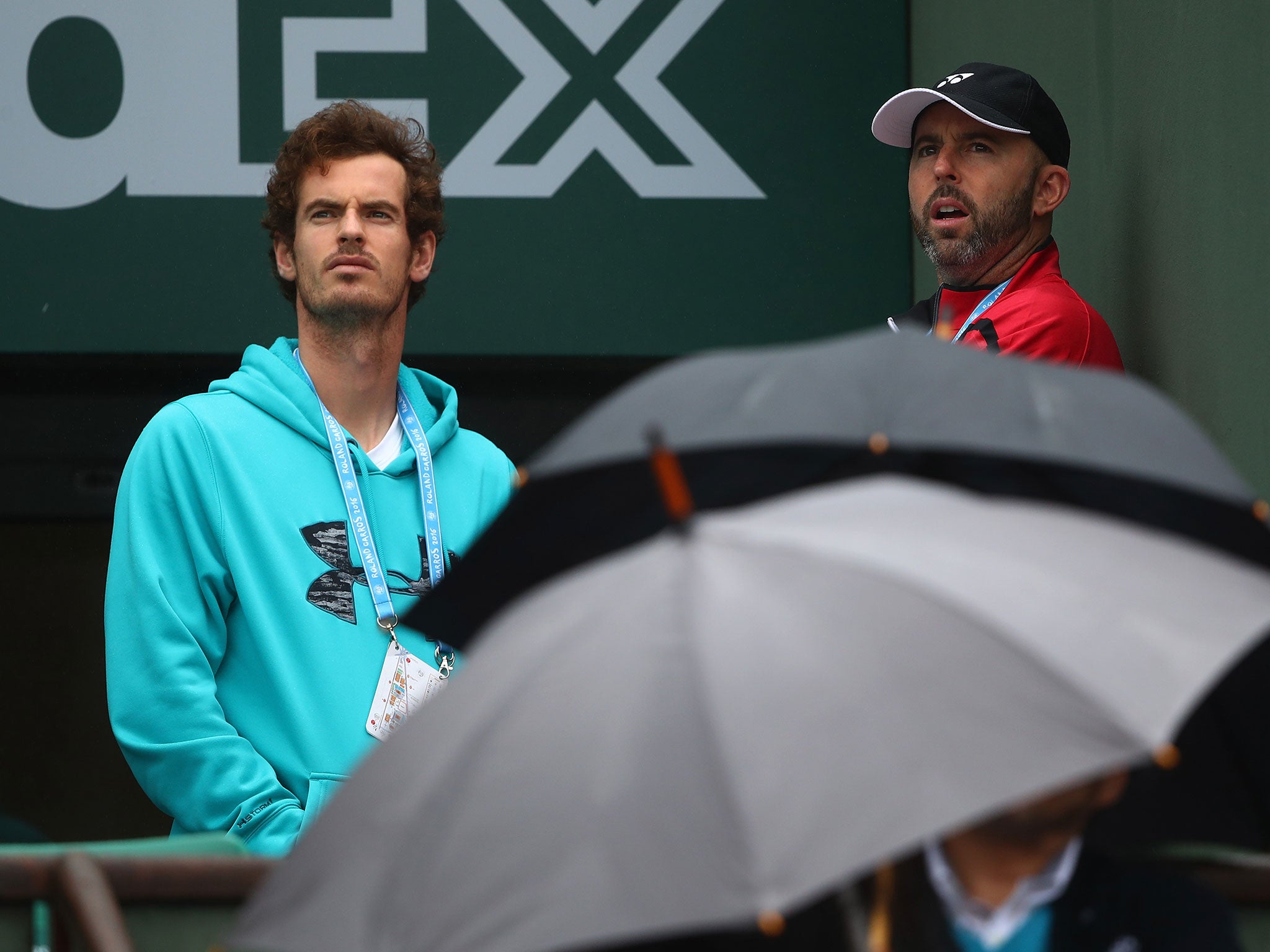 Andy Murray assesses the conditions at the French Open