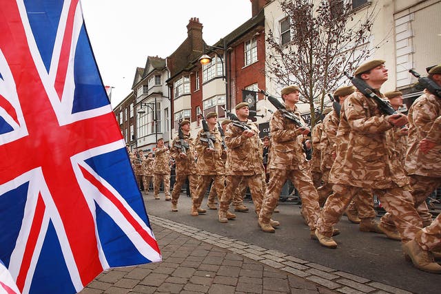 Soldiers from the The Royal Anglian Regiment parade through Watford
