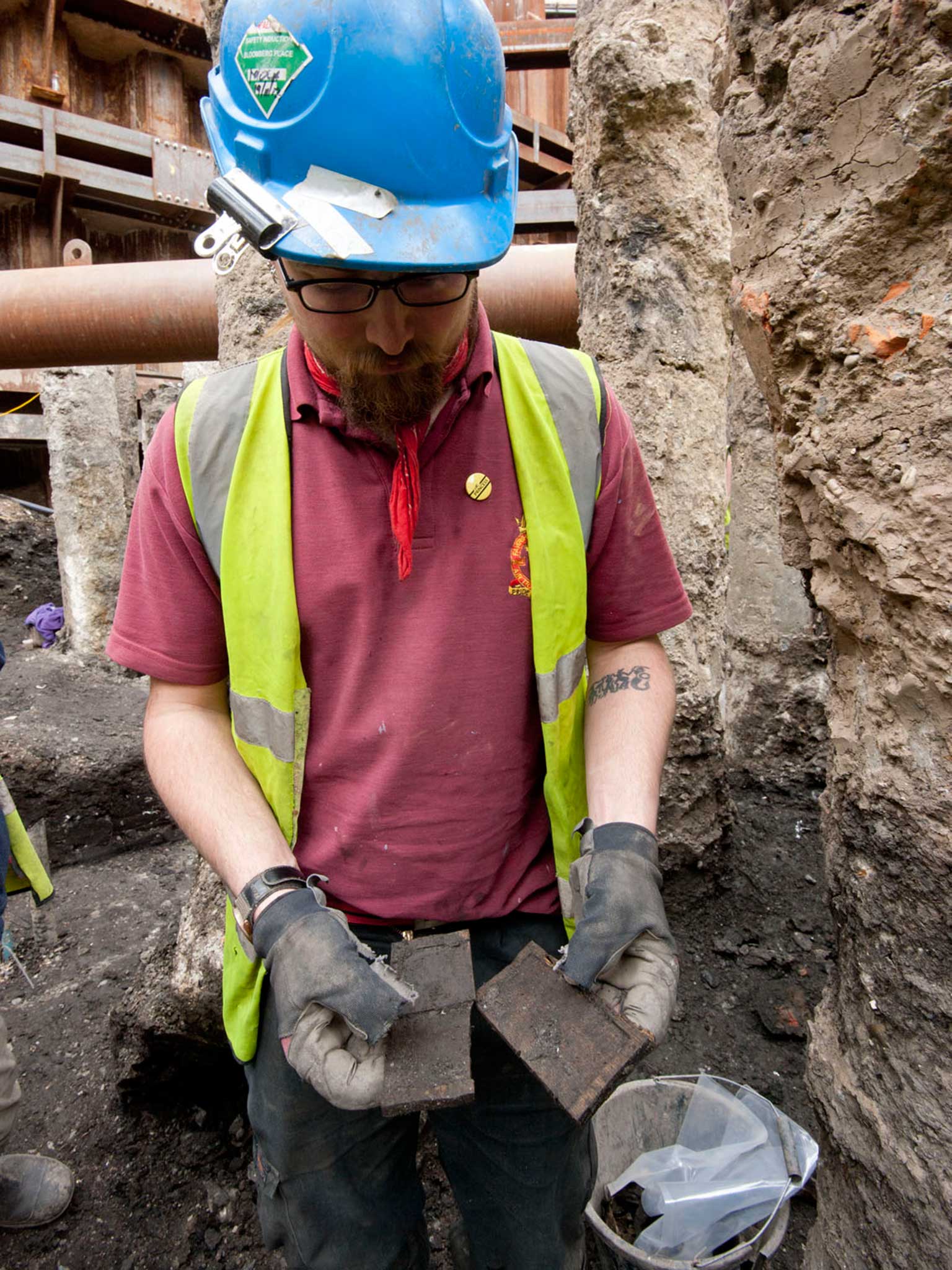 Archaeologist with a tablet just discovered at the Bloomberg site