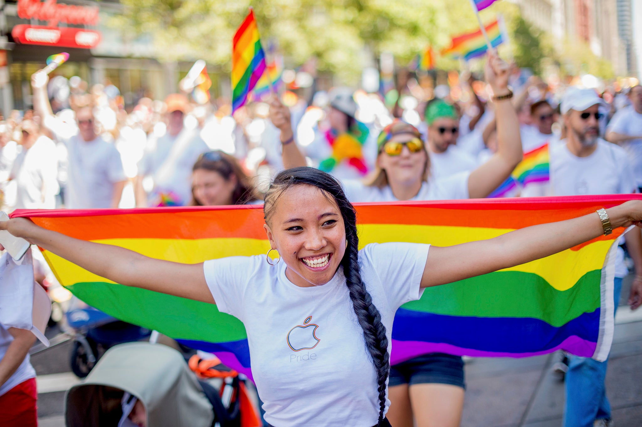 Apple retail employee Minh Phan marches in the San Francisco Gay Pride Festival in California June 29, 2014
