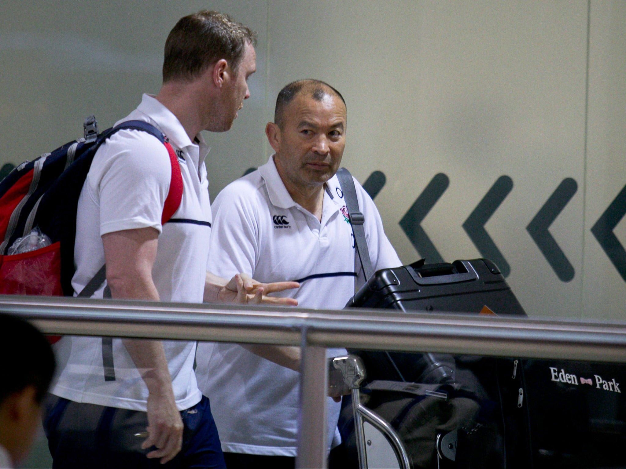 Eddie Jones arrives at Brisbane Airport with the rest of the England squad