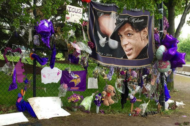 Fans have left tributes outside the musician's Minneapolis home