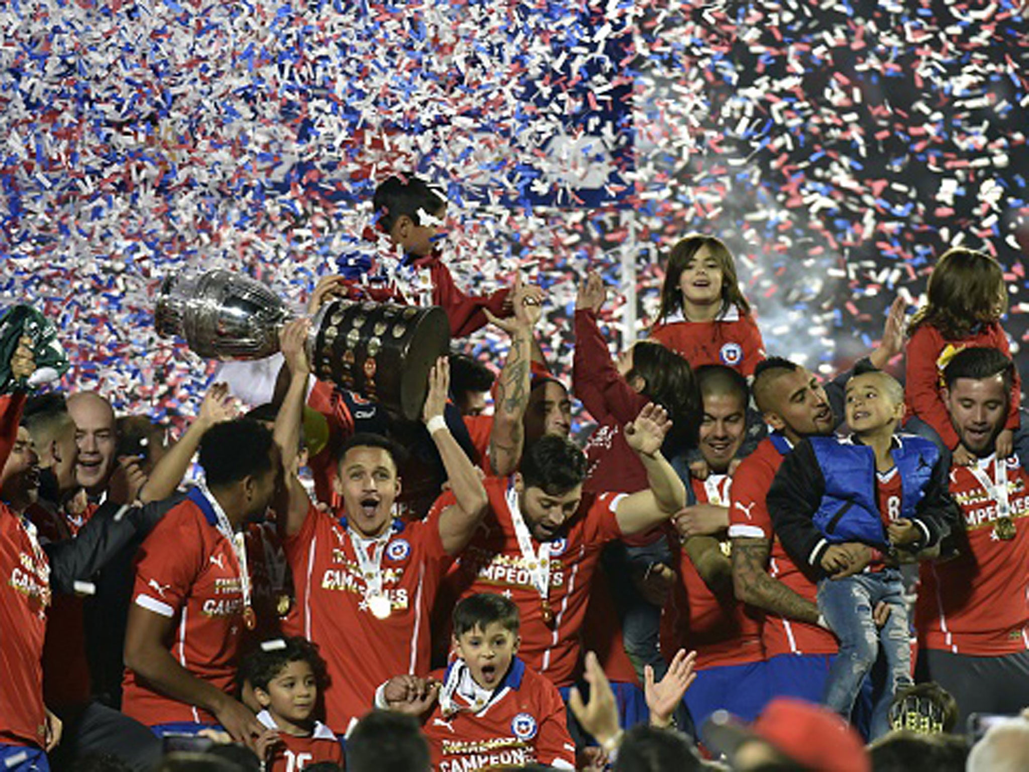 Alexis Sanchez leads Chile celebrations after their Copa America success on home soil last summer - their first victory in the tournament (Getty)