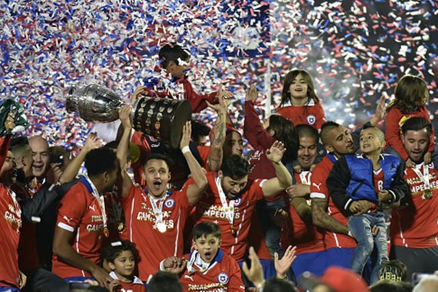 Alexis Sanchez leads Chile celebrations after their Copa America success on home soil last summer - their first victory in the tournament (Getty)