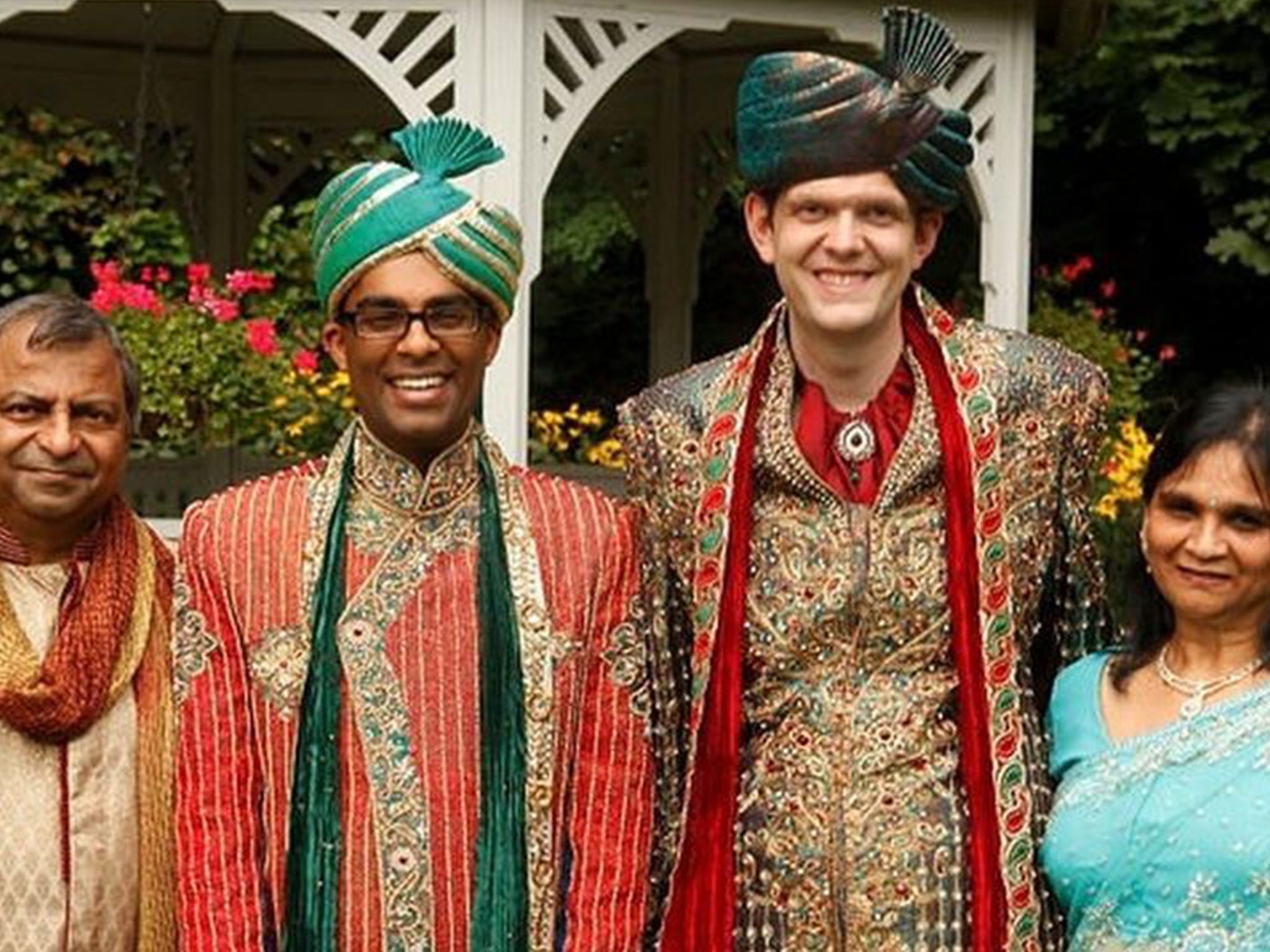 The couple with Rishi's parents at their traditional Hindu wedding