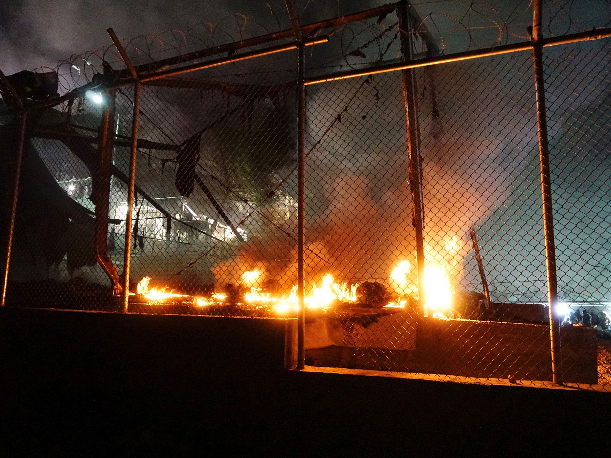 A fire burns at the Moria detention camp following clashes