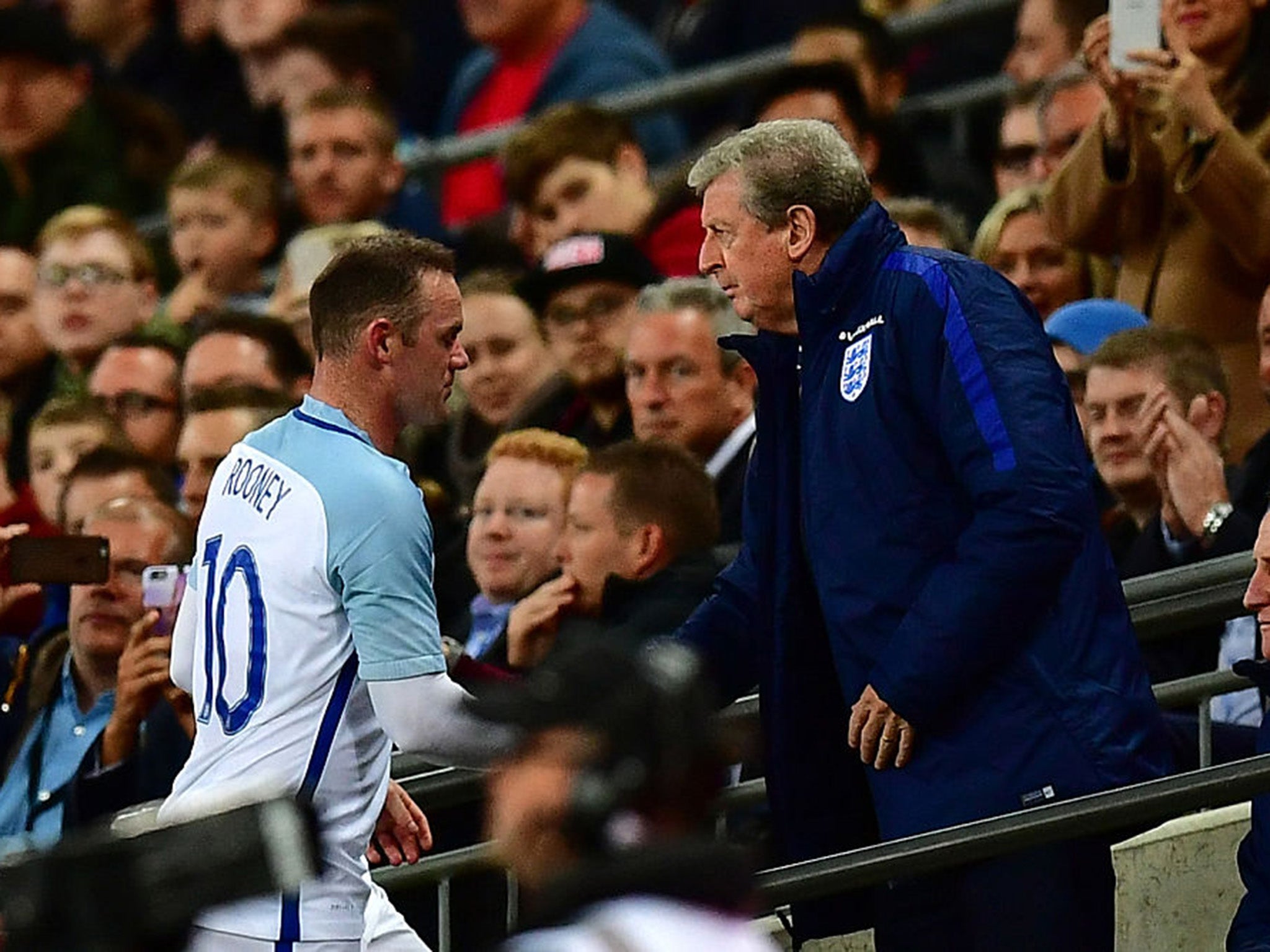 Roy Hodgson shakes Wayne Rooney's hand after substituting his captain against Portugal