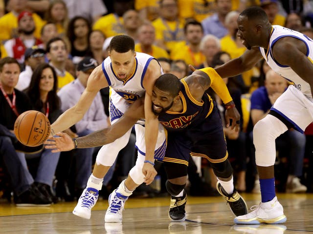 Steph Curry competes for the ball with Kyrie Irving during match one of the NBA Finals