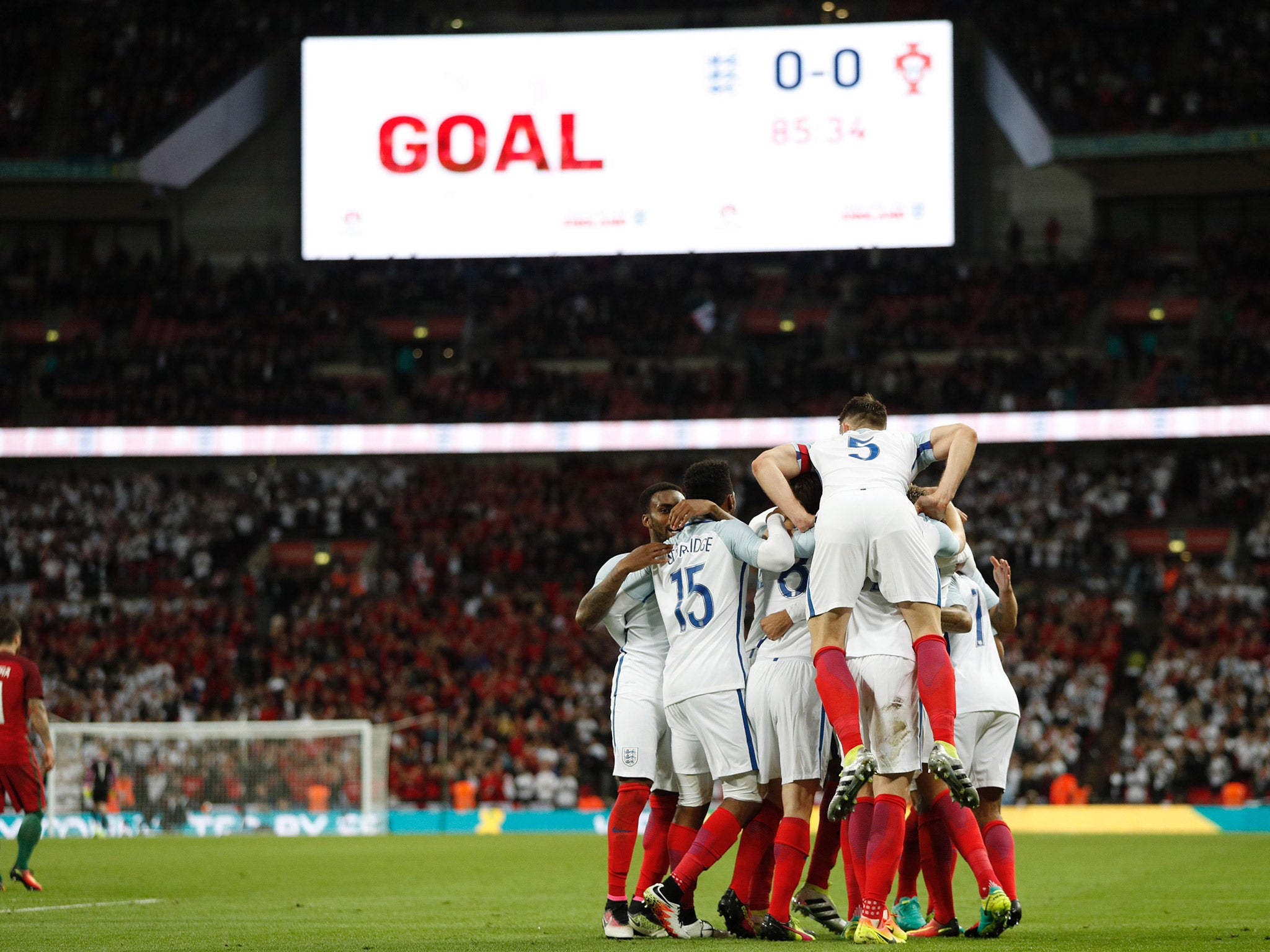 England celebrate after Chris Smalling scores the match-winning goal against Portugal