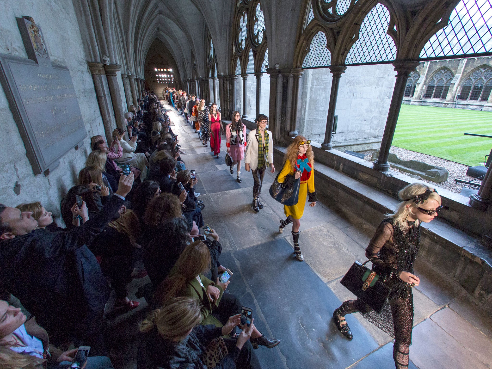 Models parade through the cloisters of Westminster Abbey for Gucci's latest Cruise show