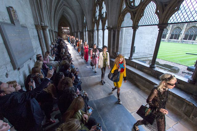 Models parade through the cloisters of Westminster Abbey for Gucci's latest Cruise show