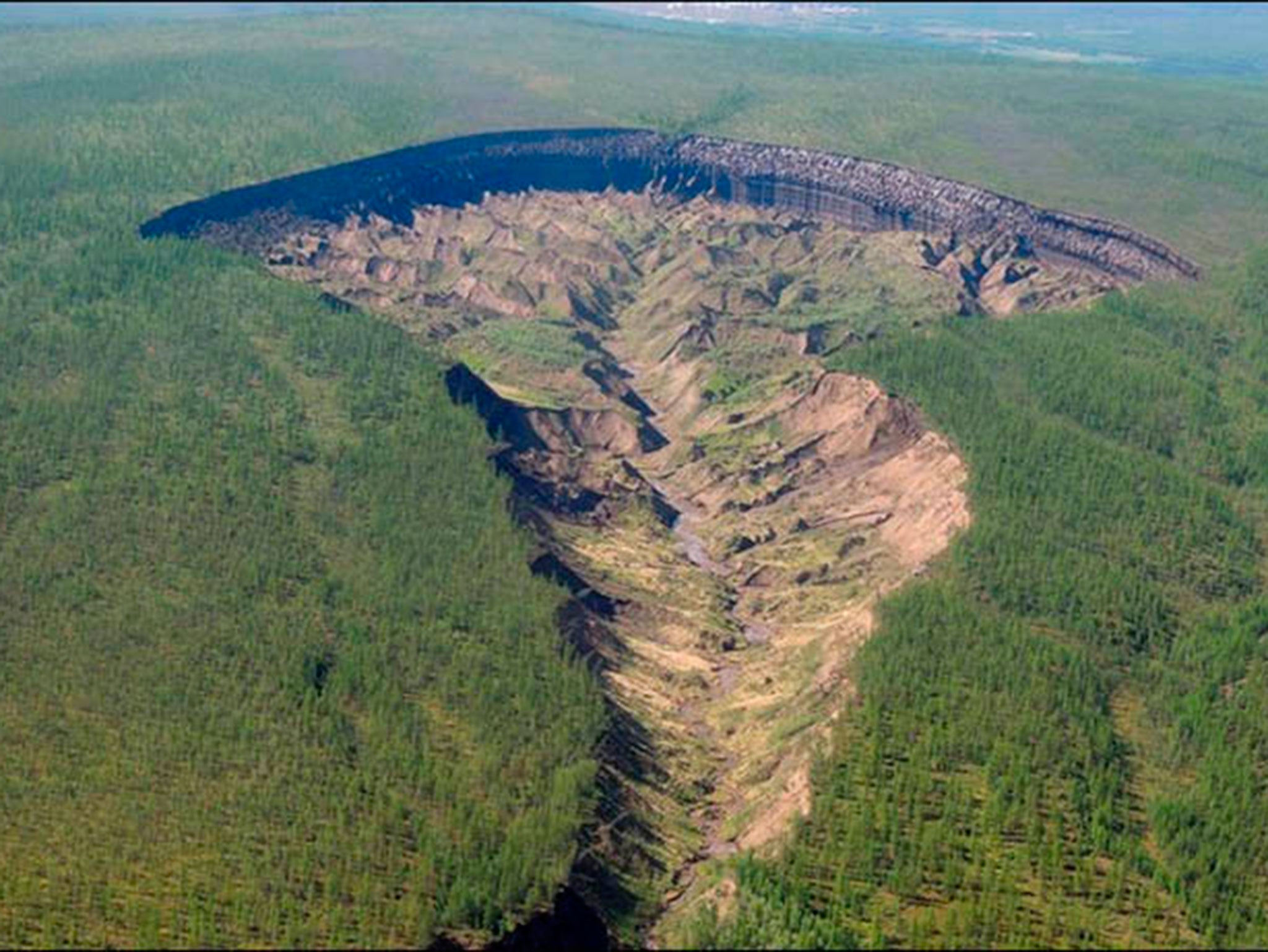 The Batagaika crater in Siberia is widening by up to 20m a year and is a sign of the rate at which the world is warming