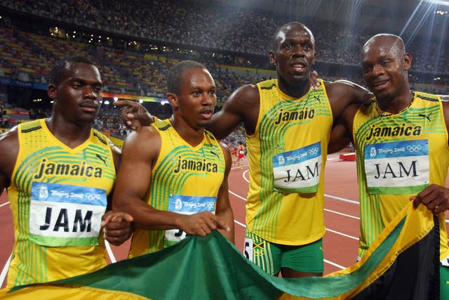 (L-R) Nesta Carter, Michael Frater, Usain Bolt and Asafa Powell celebrate Jamaica's 4x100m relay victory in 2008