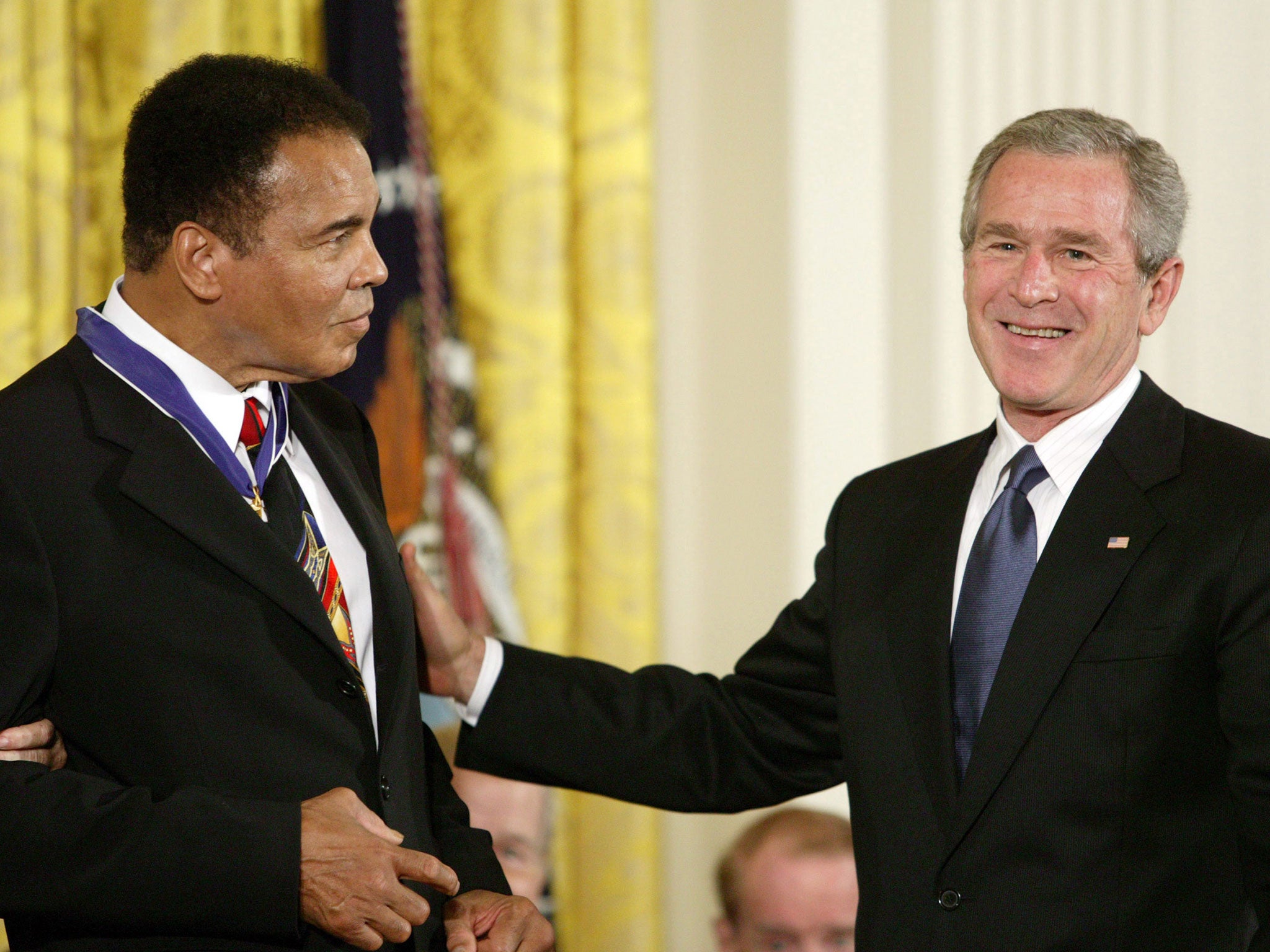 Muhammad Ali and President George W. Bush at the Freedom Awards Ceremony at the White House in Washington D.C. on November 9, 2005