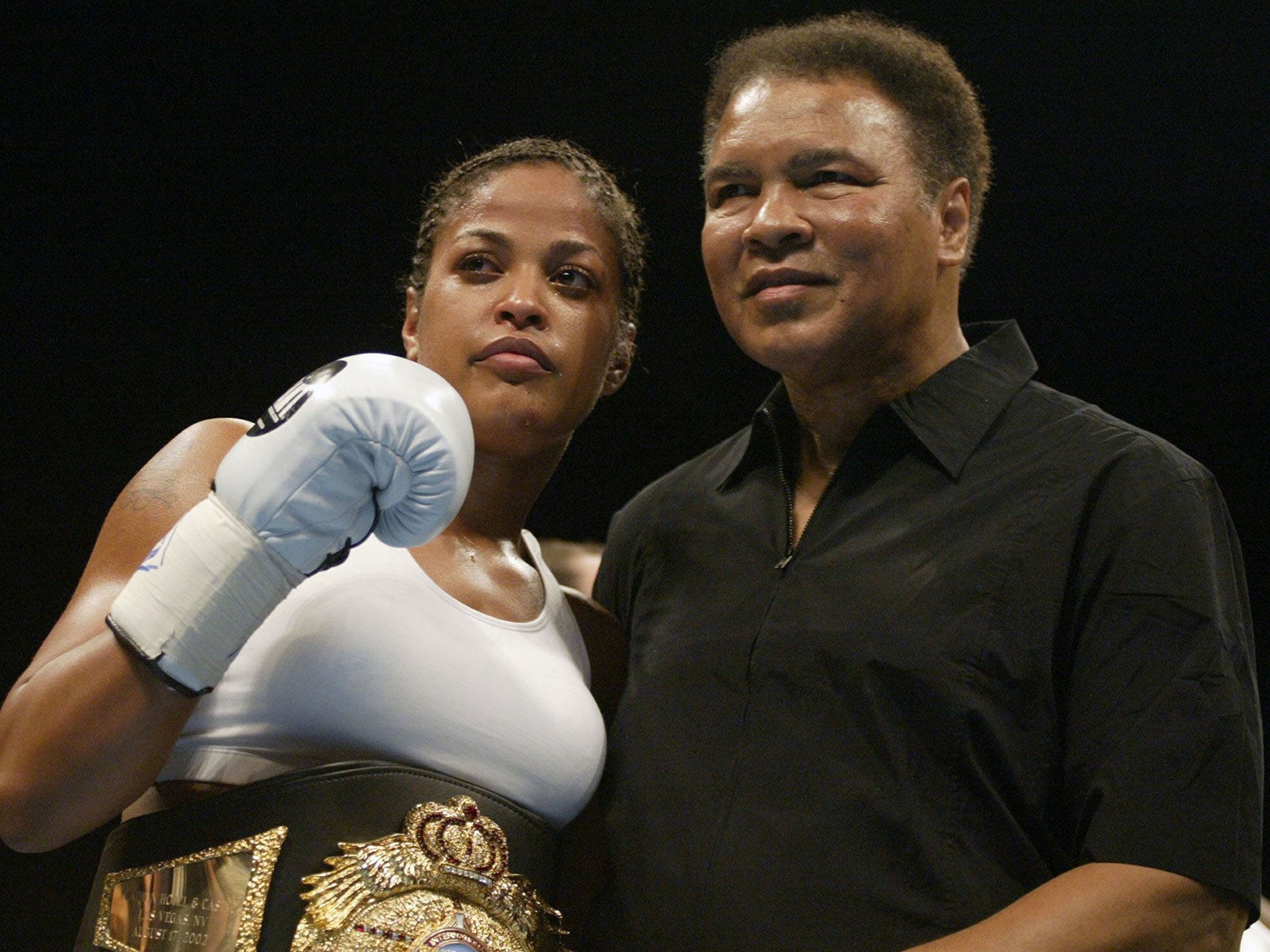 Muhammad Ali with his daughter Laila Ali after she defeated Suzy Taylor in two rounds at the Aladdin Casino in Las Vegas in 2002