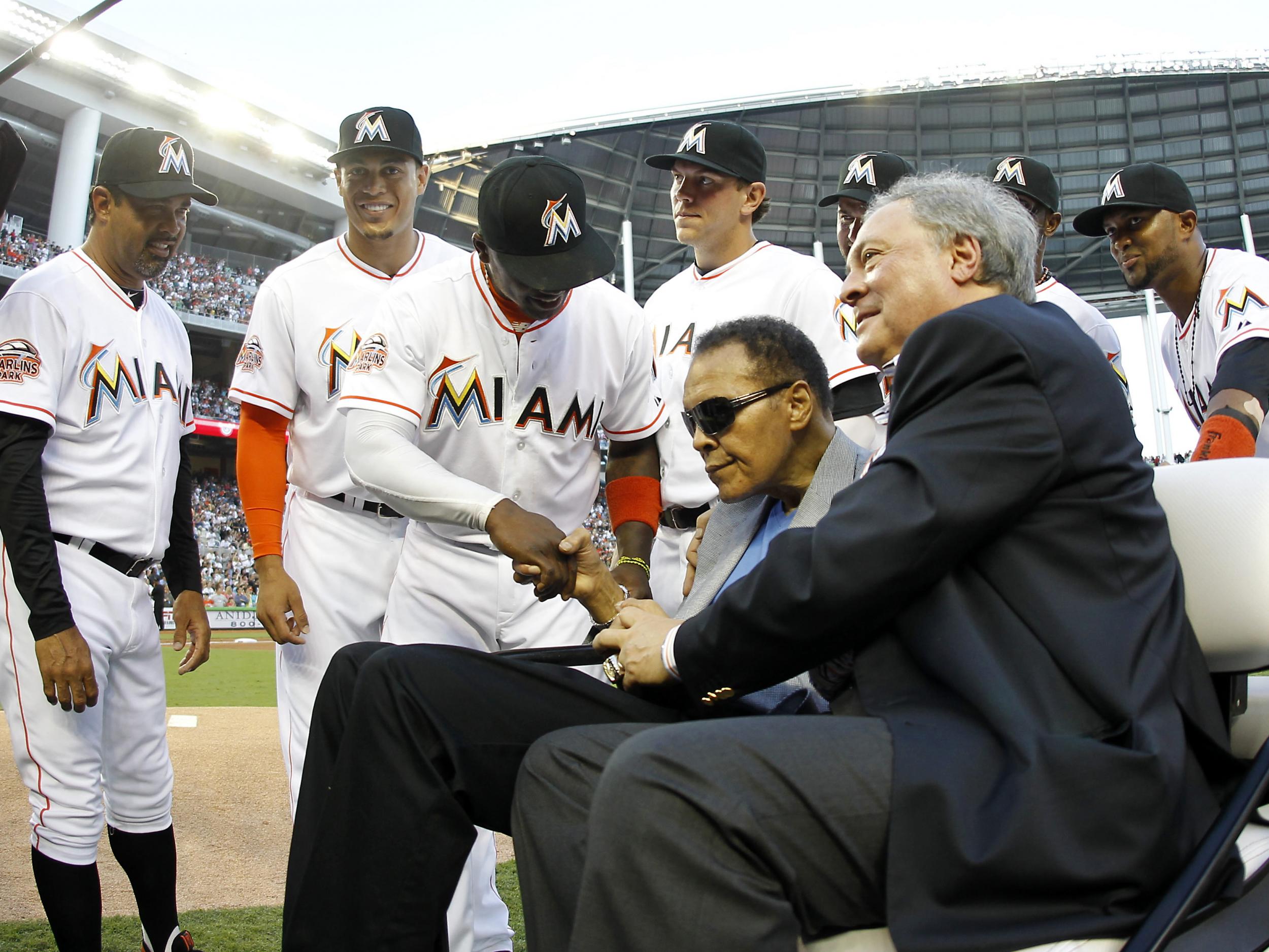 Boxing legend Muhammed Ali rides with Miami Marlins owner Jeffery Loria