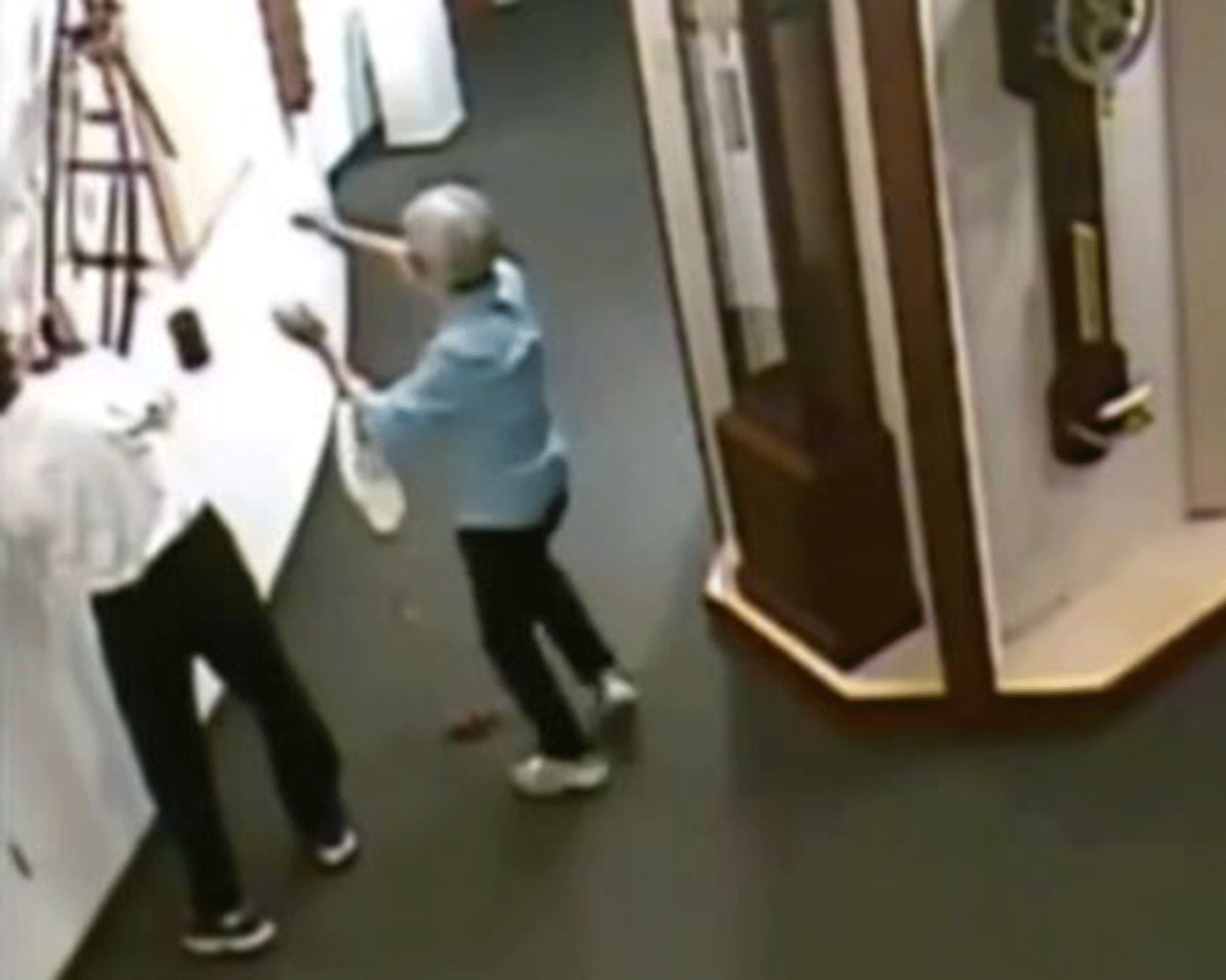 The man quickly left after he was unable to reattach the clock to the wall