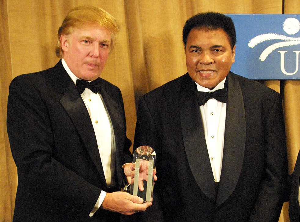 Muhammad Ali receives The UCP's Humanitarian Award from Donald Trump at the United Cerebral Palsey dinner at the Marriott Marquis Hotel in New York, on March 14, 2001