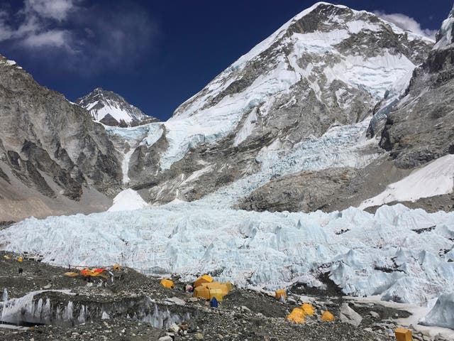 Yellow and orange tents at Everest Base Camp, pitched on the edges of the Khumbu icefall
