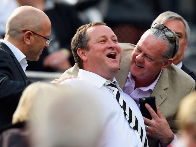 Mike Ashley (centre) has previously refused to give evidence to MPs about working conditions at his company