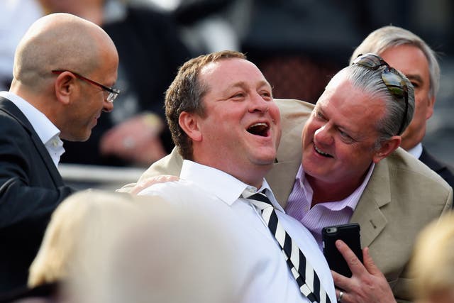 Mike Ashley (centre) has previously refused to give evidence to MPs about working conditions at his company