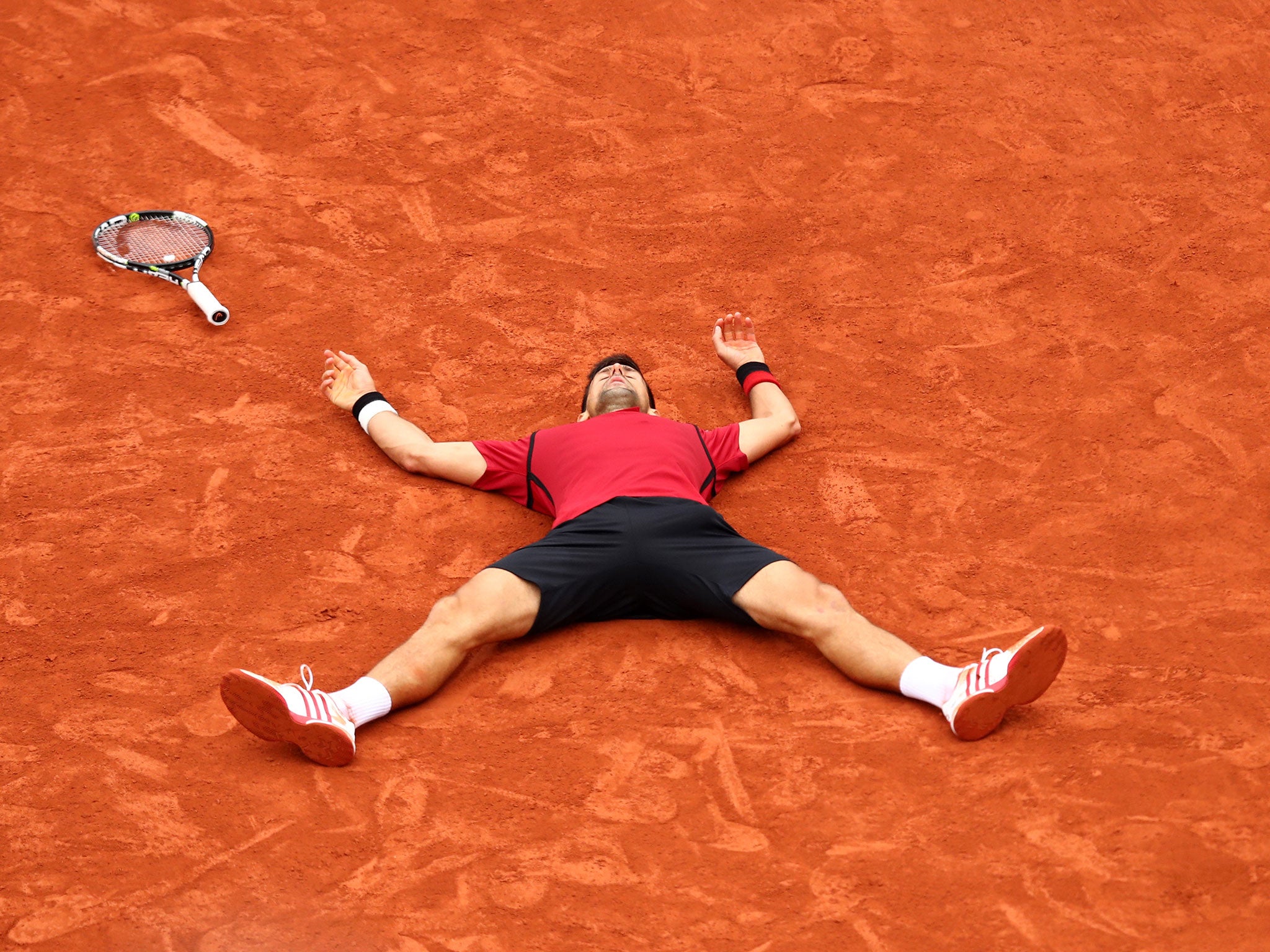 Novak Djokovic celebrates victory in the French Open final