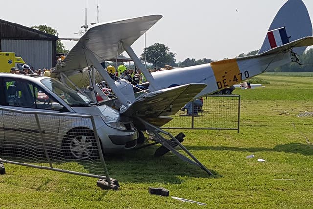 A Tiger Moth biplane hit a car after it crashed shortly after take-off yesterday at Brimpton Airfield near Reading