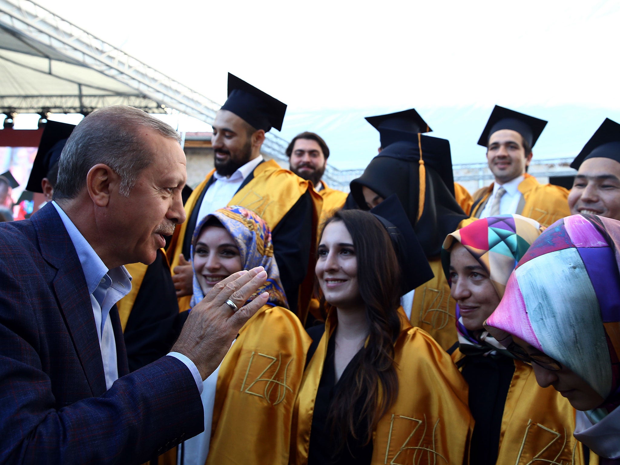 Turkey's President Recep Tayyip Erdogan speaks with students at the Sabahattin Zaim University in Istanbul