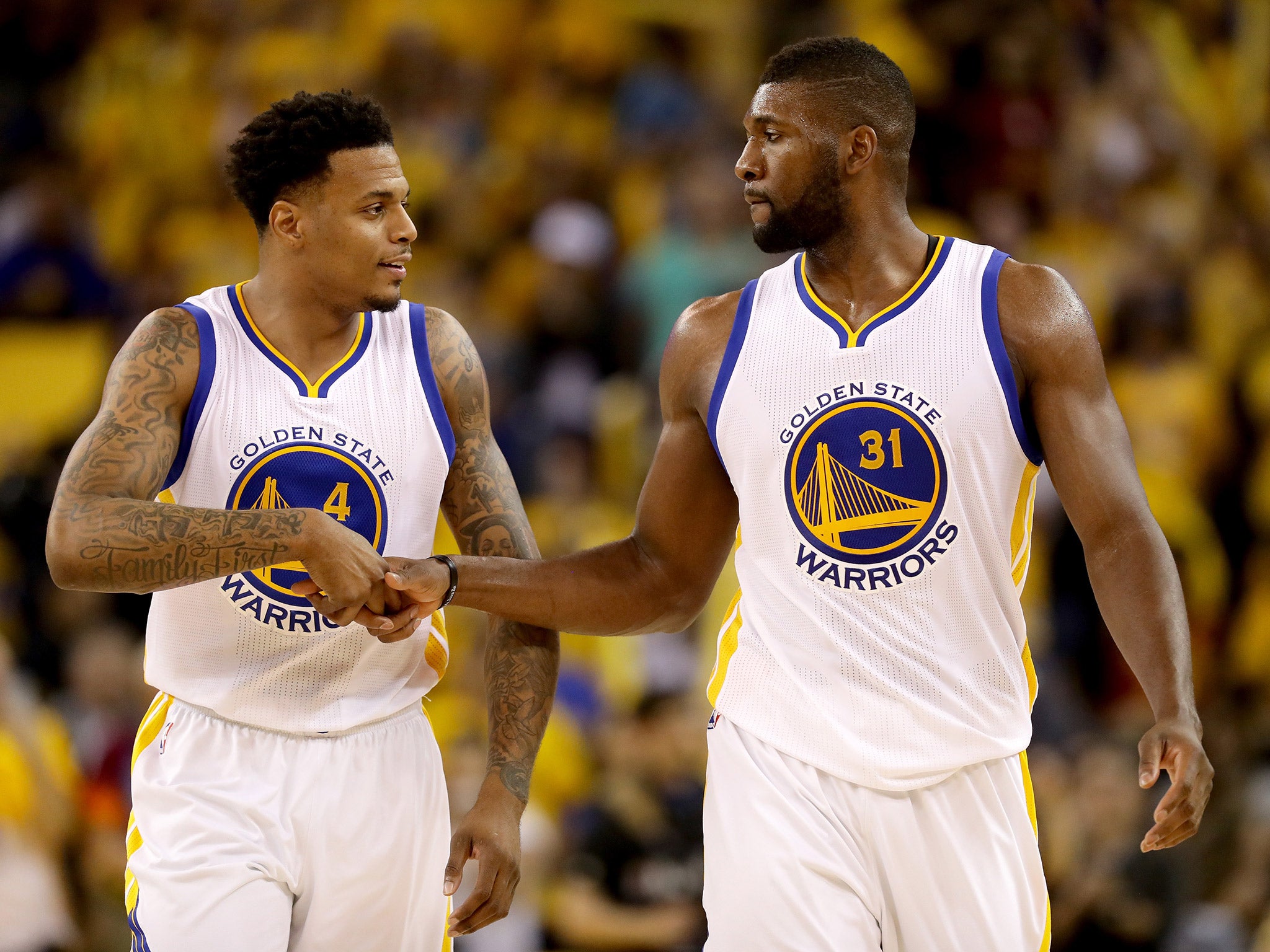 Brandon Rush and Festus Ezeli celebrate after game two of the NBA Finals