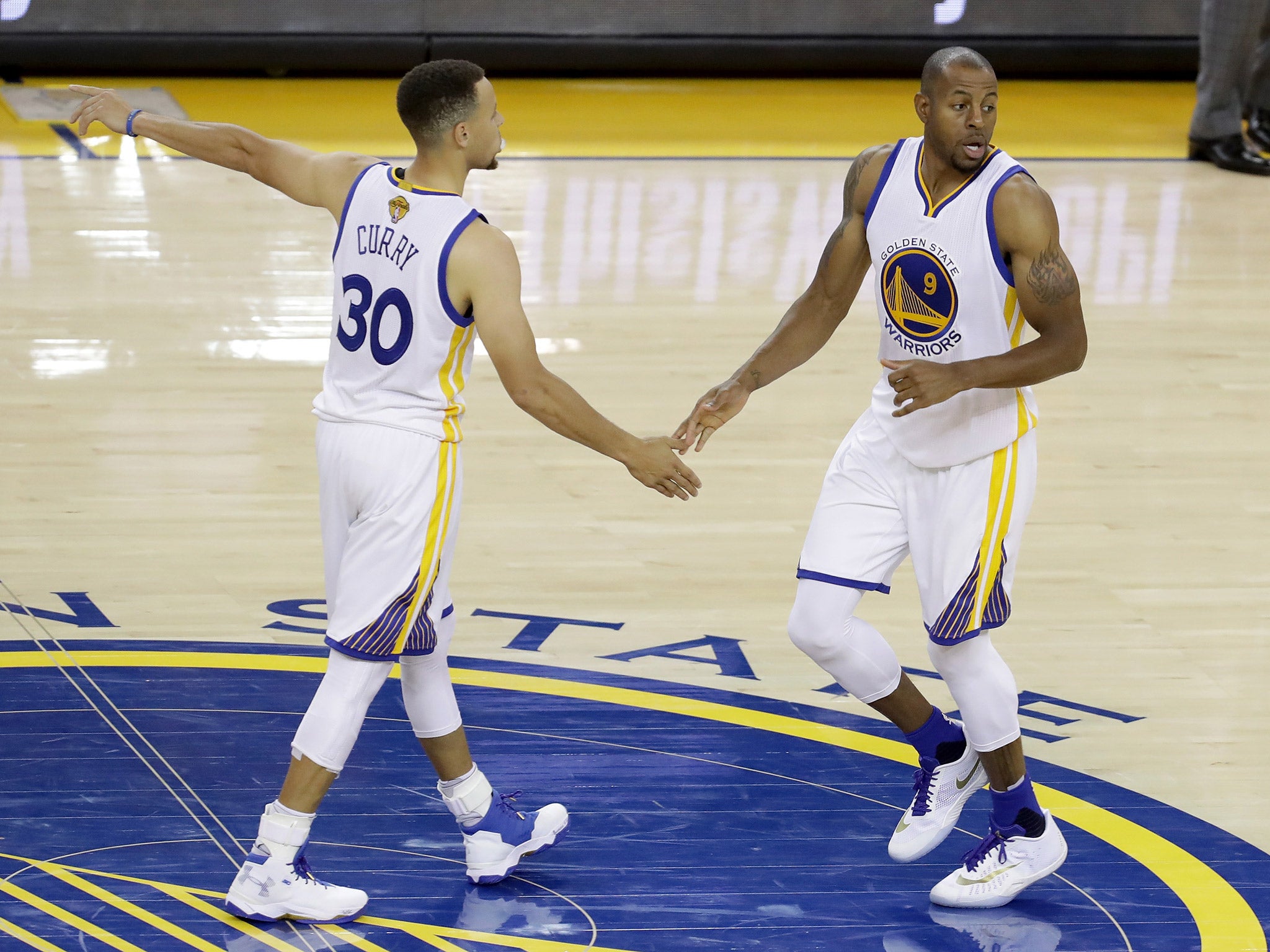 Steph Curry and Andre Iguodala celebrate during game two of the NBA Finals