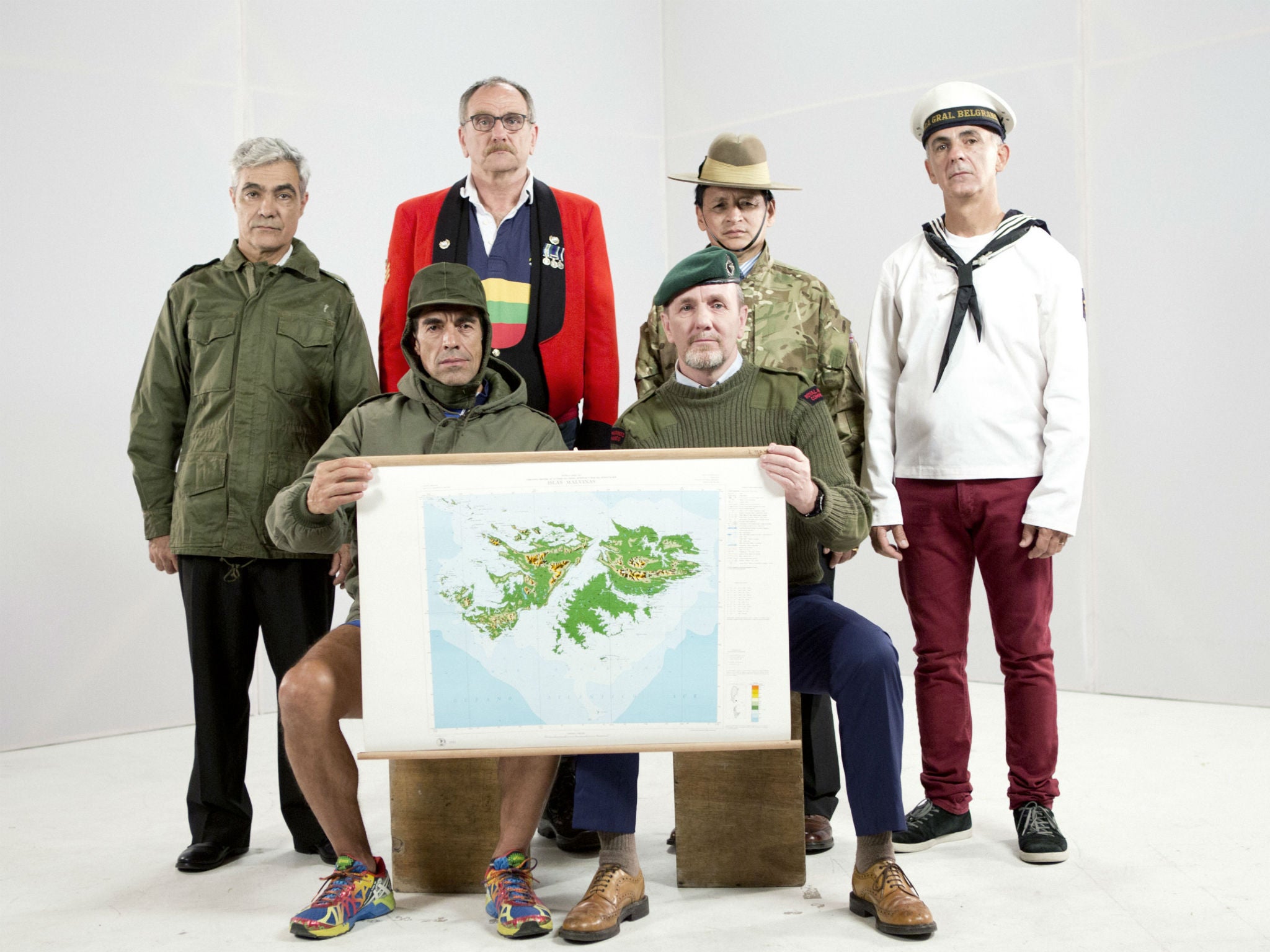 (Standing L-R) Gabriel Sagastume, David Jackson, Sukrim Rai, Rubén Otero (Sitting L-R) Marcelo Vallejo, Lou Armour with map of the Falklands/Malvinas