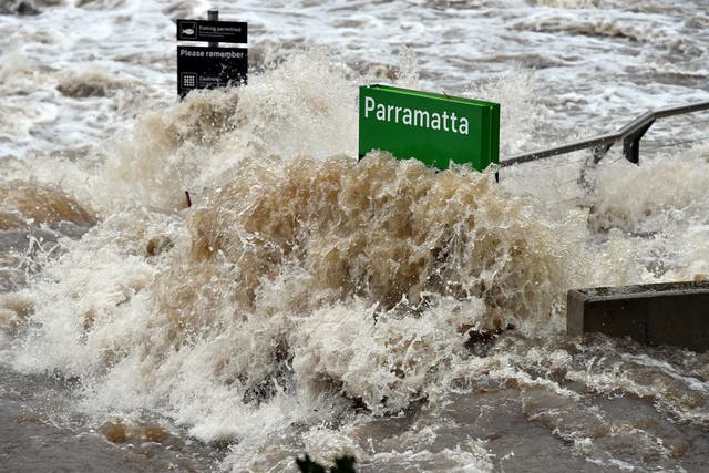 A ferry terminal is submerged by the overflowing Parramatta river in Sydney