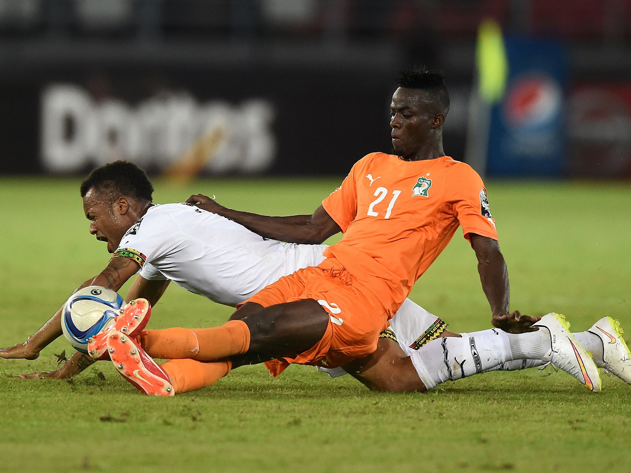 Bailly fells Ghana's Jordan Ayew during the 2015 Africa Cup of Nations final
