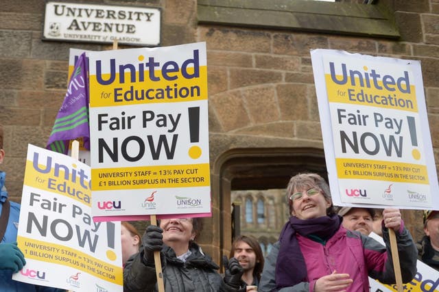 Staff strike outside Glasgow University in a similar dispute in 2013 (Jeff J Mitchell/Getty)