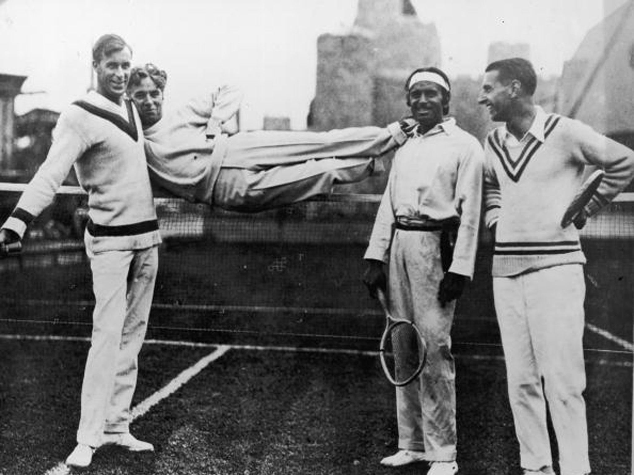 Bill Tilden (left) and Manuel Alonso (right) pose with actors Charlie Chaplin (second left) and Douglas Fairbanks Sr (second right) in California in 1923 (Getty)