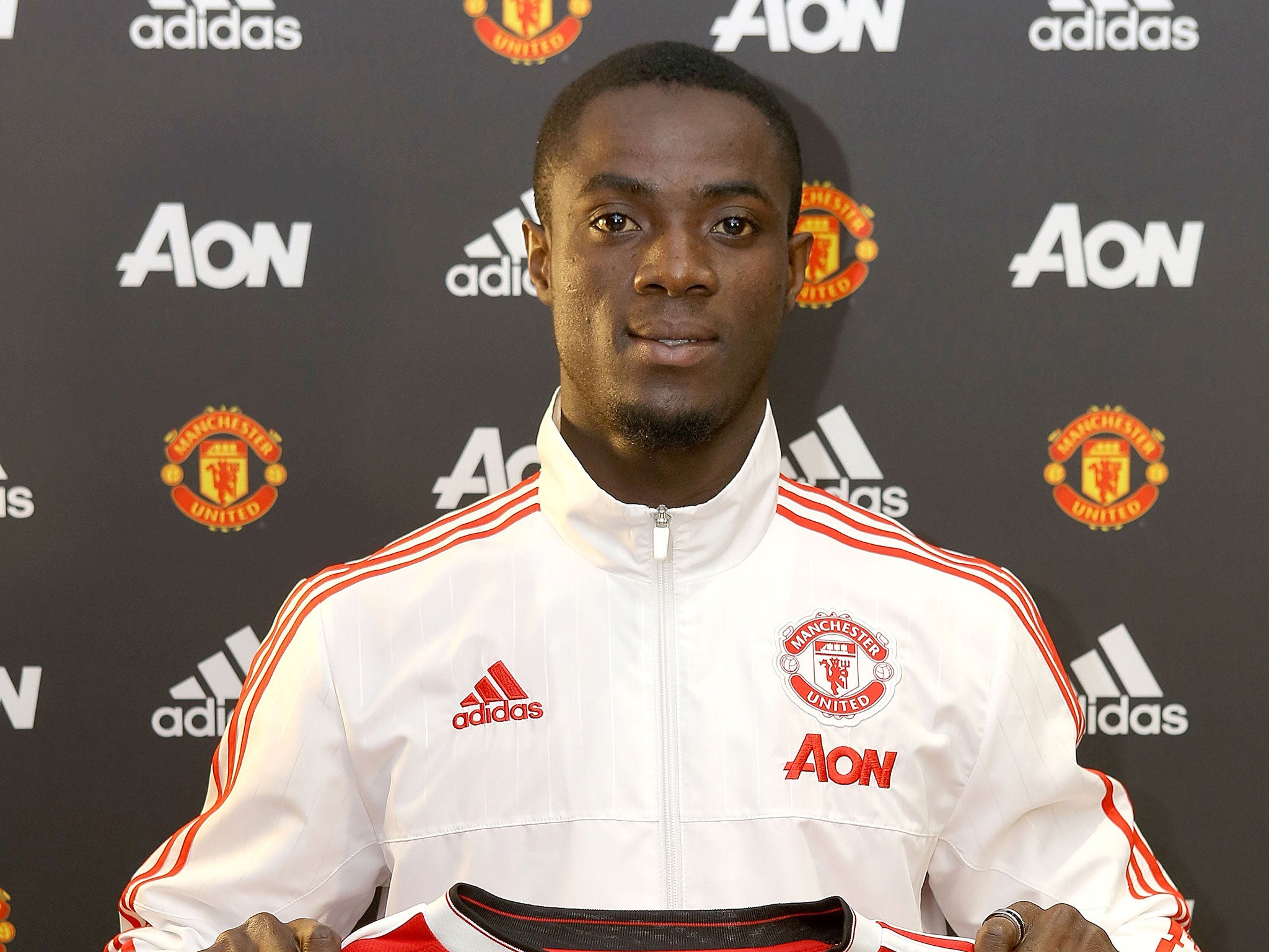 Eric Bailly poses following his £30m transfer to Manchester United