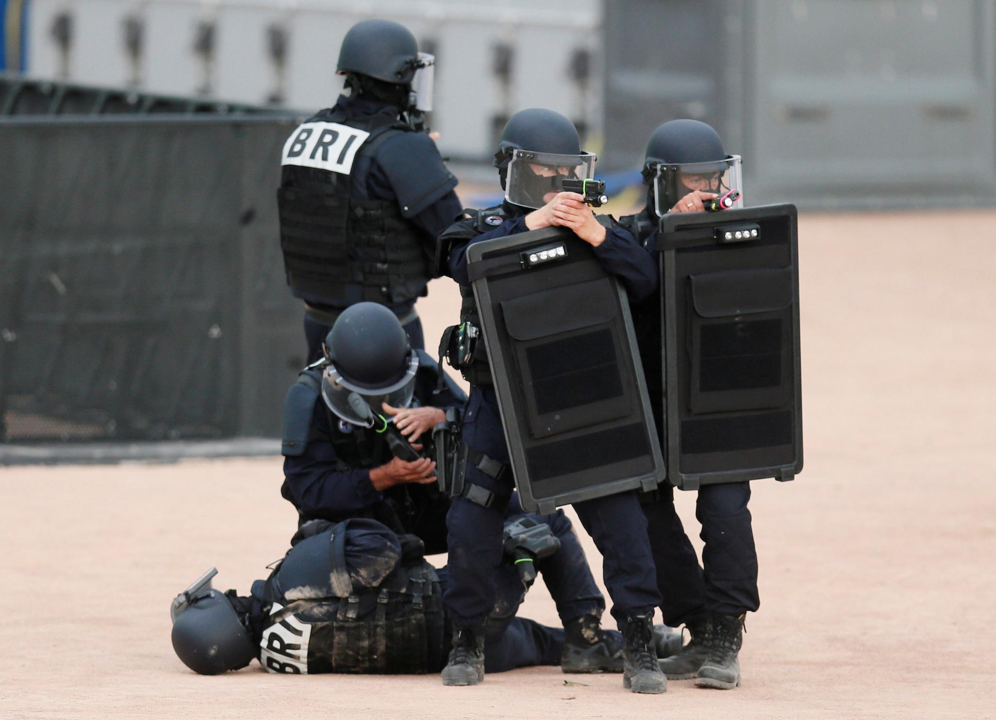 French police forces take part in a mock attack drill in the fan zone in the centre of Lyon, France