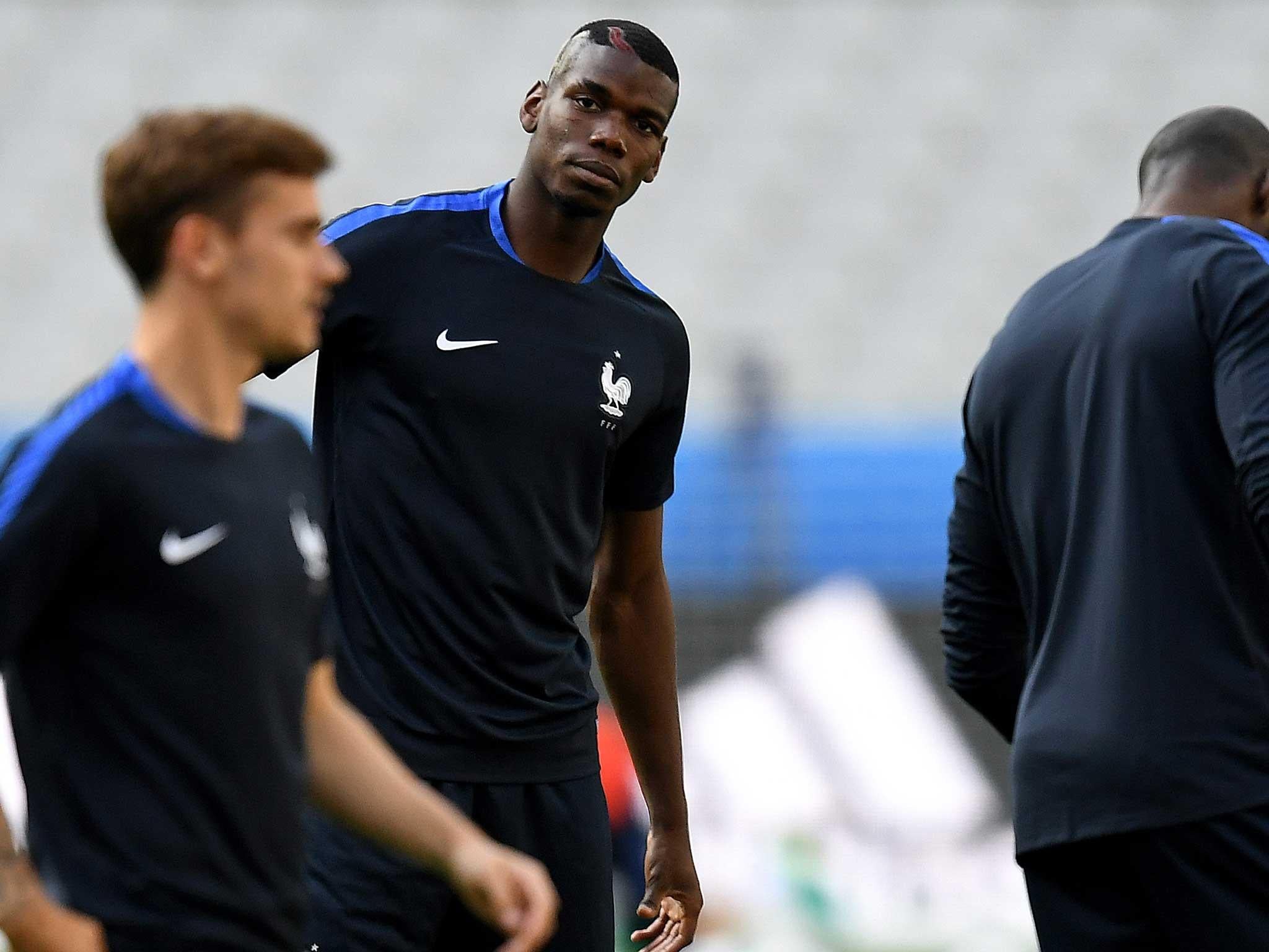 Paul Pogba warms up for France's Euro 2016 opener this weekend