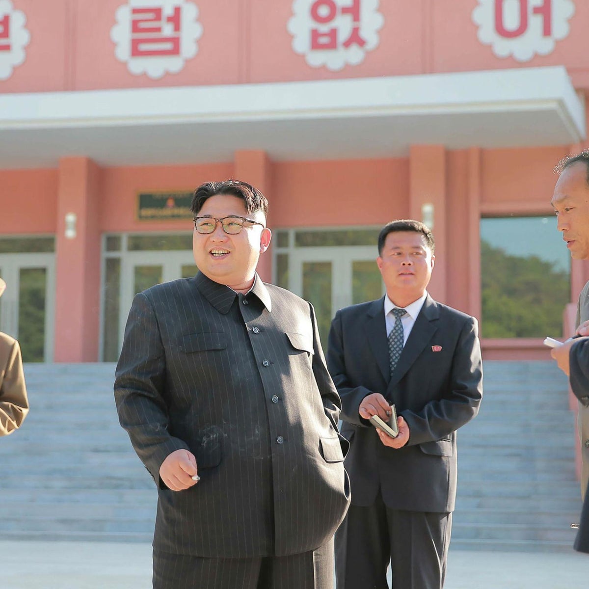kim jong un smoking a cigarette reappears at military meeting, orders 'intensified' training Kim Jong Un pictured smoking
