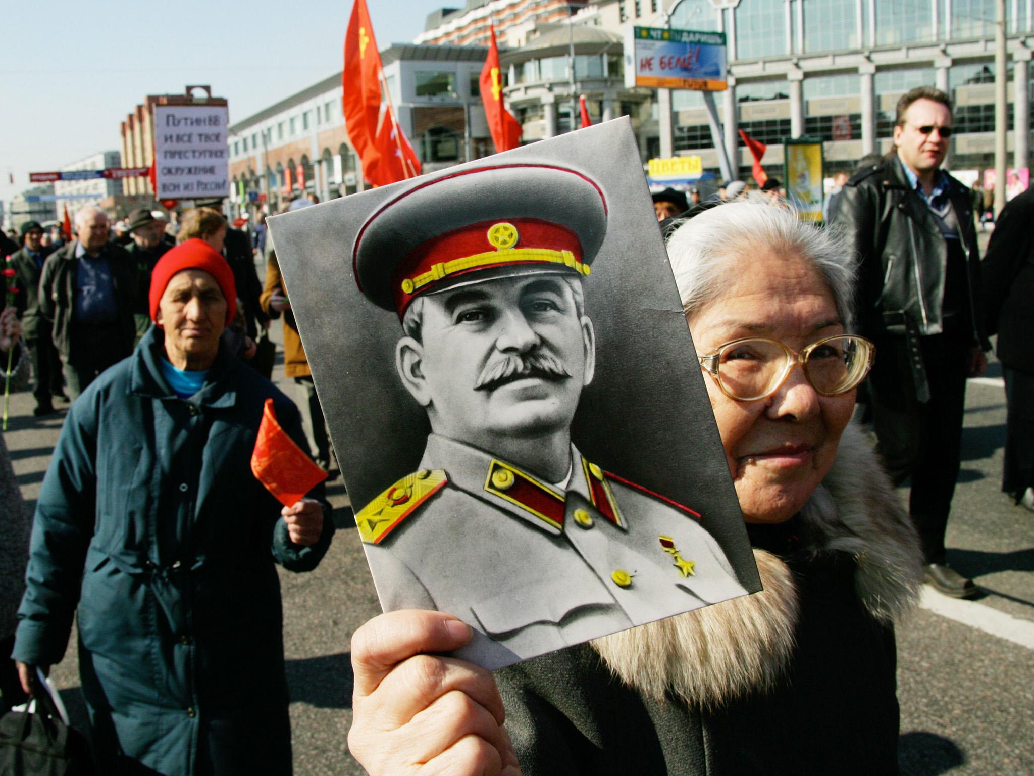 Communist demonstrators march through Moscow on a May Day rally