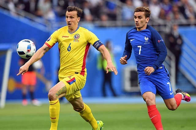Vlad Chiriches and Antoine Griezmann in action during France's 2-1 win over Romania on Friday night (Getty)