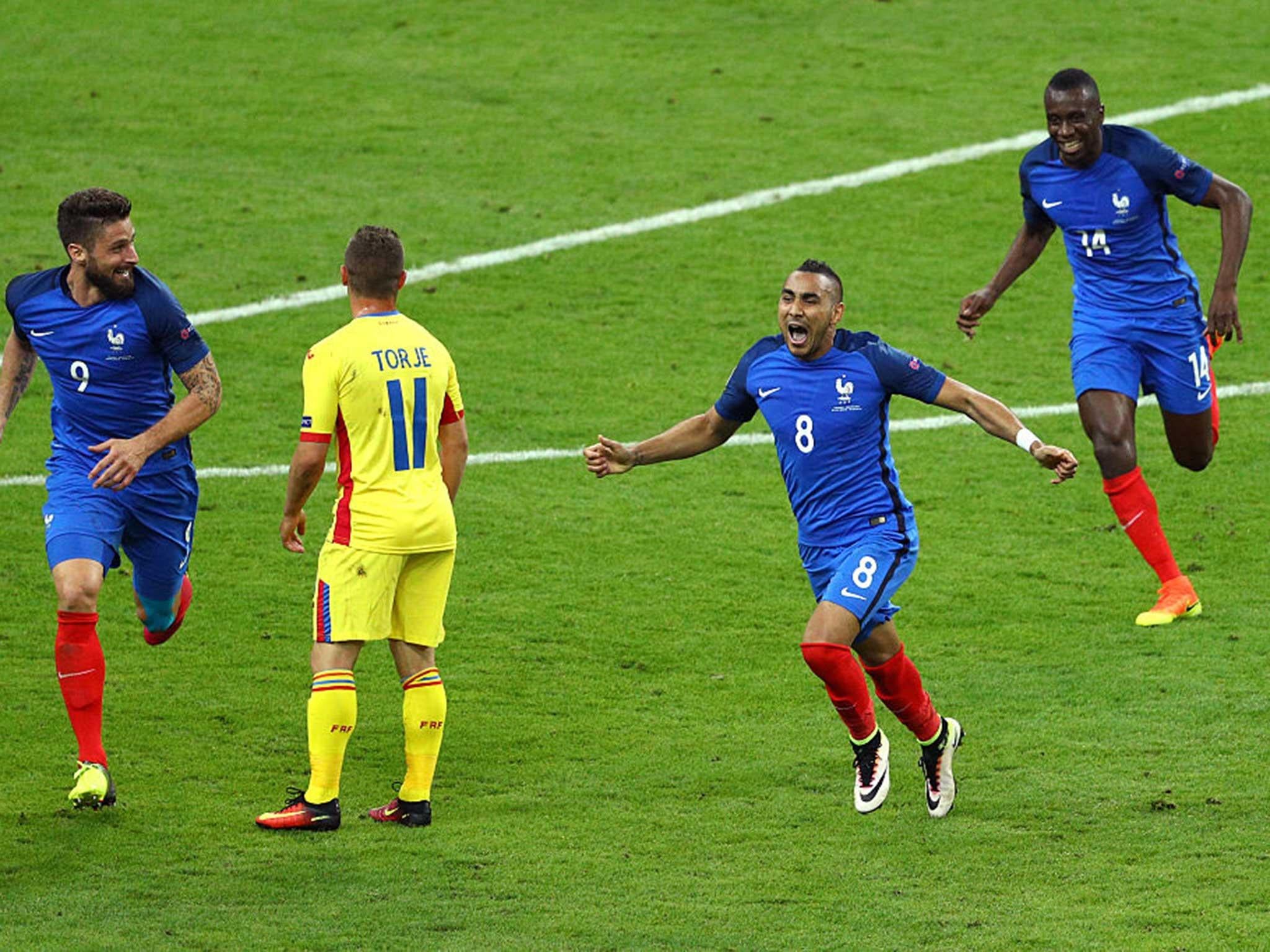 Dimitri Payet wheels away in celebration after striking late for France