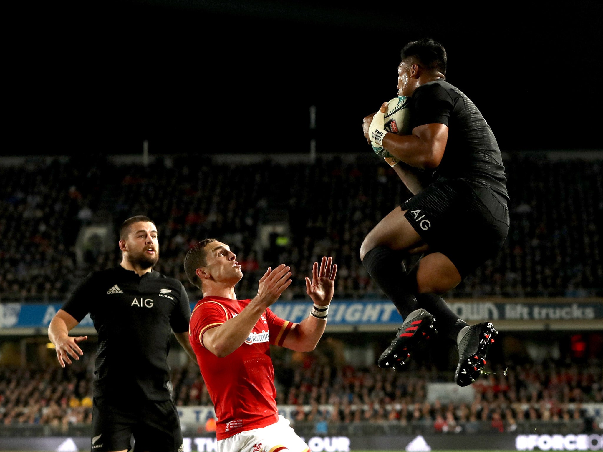 Julian Savea leaps to catch the ball and score New Zealand's first try against Wales