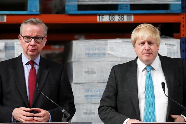 Michael Gove (left) and Boris Johnson and address workers during a Vote Leave campaign in Stratford-Upon-Avon